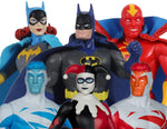 A group of DC Comics action figures including Batman, Harley Quinn, The Flash, Cyborg, and Red Hood, arranged together on a white background with an Entertainment Earth Exclusive Limited Edition sticker in the corner.