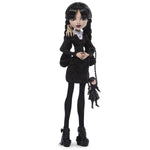 Monster High Wednesday Addams doll by Mattel featuring her signature black and white outfit and iconic braided pigtails.