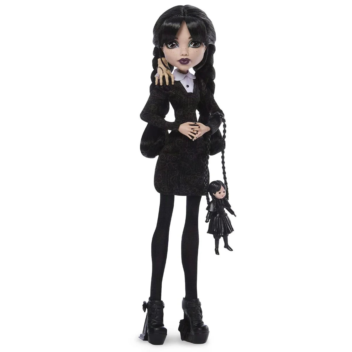 Monster High Wednesday Addams doll by Mattel featuring her signature black and white outfit and iconic braided pigtails.